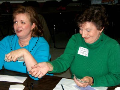 "Yes sir, the basic admission is $10." Mrs. Larry Griggers volunteers to help Marijon collect admission to pay for the reunion.