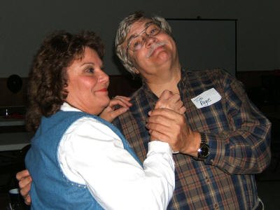 I finally learned how to dance!" beams Tim proudly. "Not really, he's standing on my foot!" complains Pat.