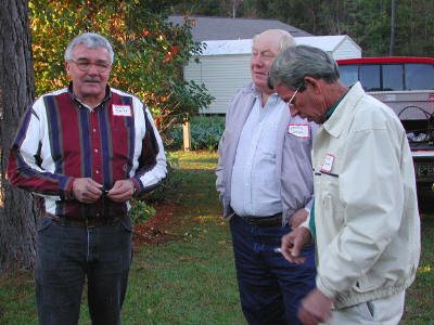 Danny Smith, Jerry Davis and Lloyd Stewart reproduce an old scene by the smoking tree at Lyons High School.