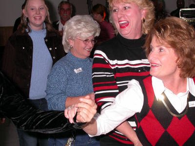 Linda Brogdon get a train started on the dance floor.